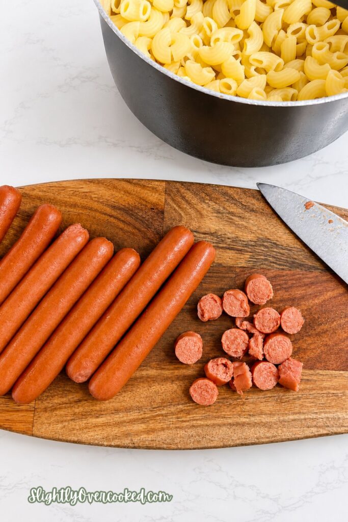 Hot dogs, country-style baked beans, and boxed macaroni and cheese ready to make an easy meal
