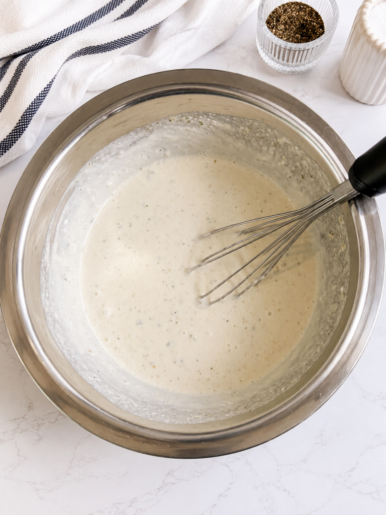 Creamy ranch sauce whisked together for bacon ranch chicken made with cream cheese, ranch seasoning, sour cream, and cream of mushroom soup.