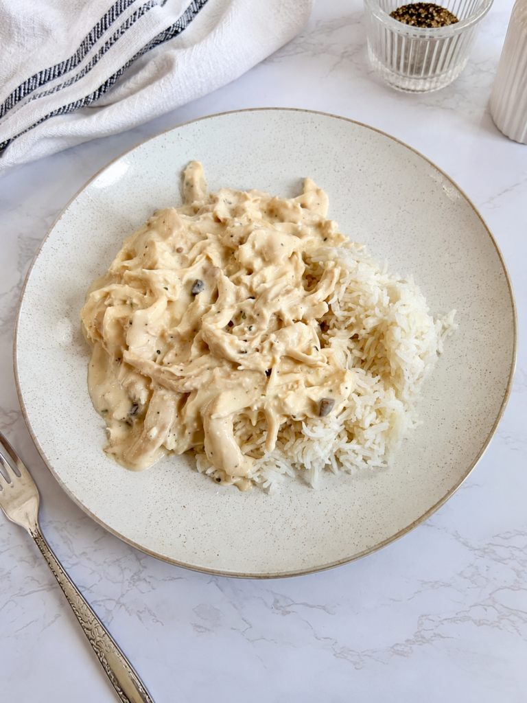 Creamy ranch chicken served over white rice with tender shredded chicken in a rich homemade ranch sauce.