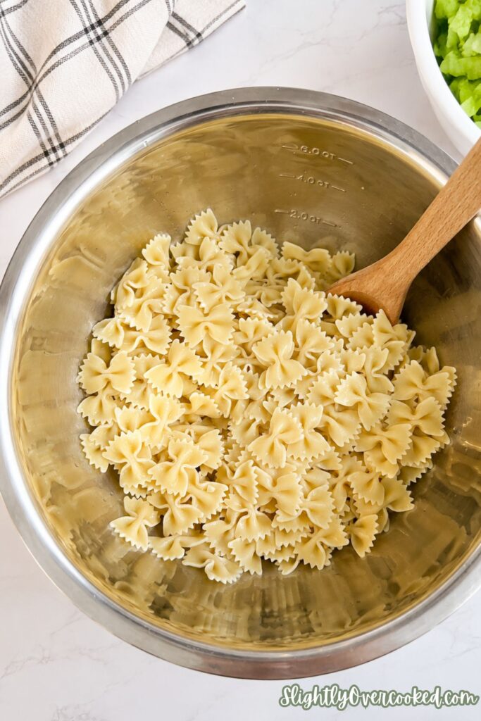 Freshly cooked farfalle pasta ready to be tossed with creamy ranch dressing.
