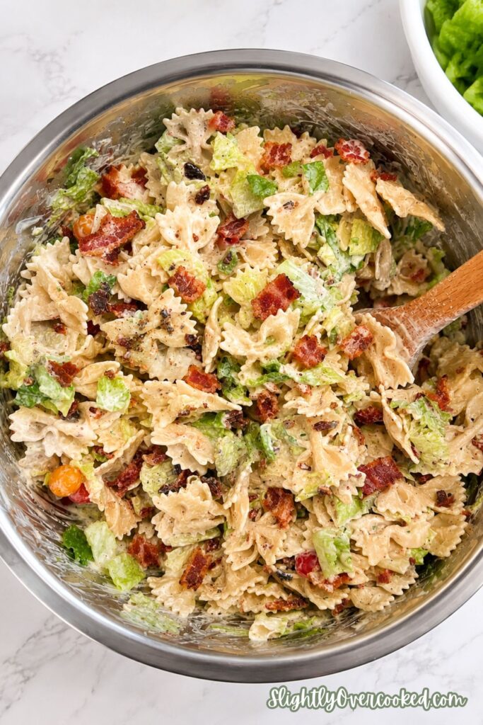 Creamy BLT pasta salad with crispy bacon, romaine lettuce, cherry tomatoes, and ranch dressing.