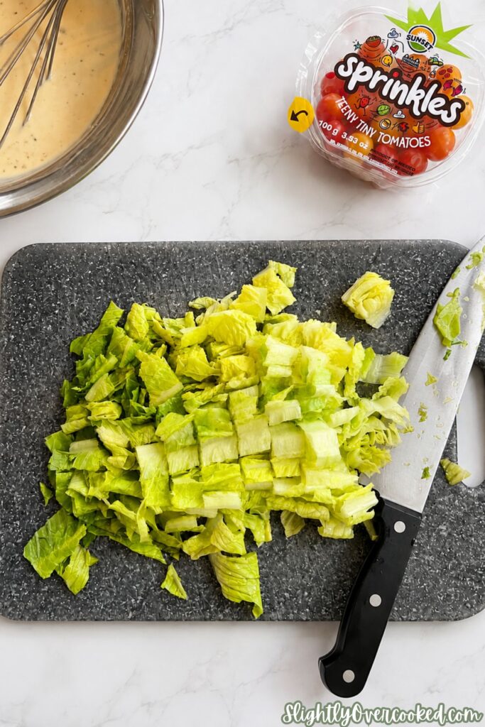 Fresh romaine lettuce chopped into bite-sized pieces for a creamy bow tie pasta salad.