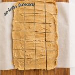 Sliced homemade peanut butter candy on a wooden cutting board with text highlighting a 4 ingredient no-bake dessert