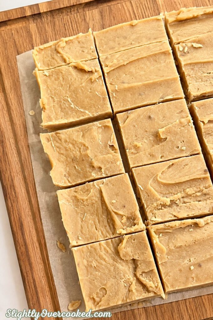 Homemade candy mixture spread in a parchment-lined pan before cooling