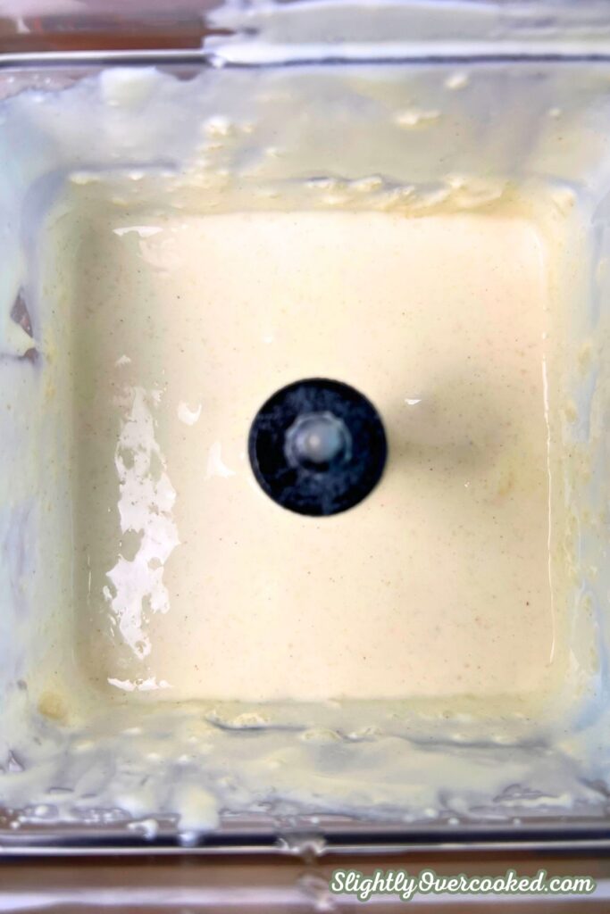 Inside the blender, showing the ice cream and pie filling all blended up.
