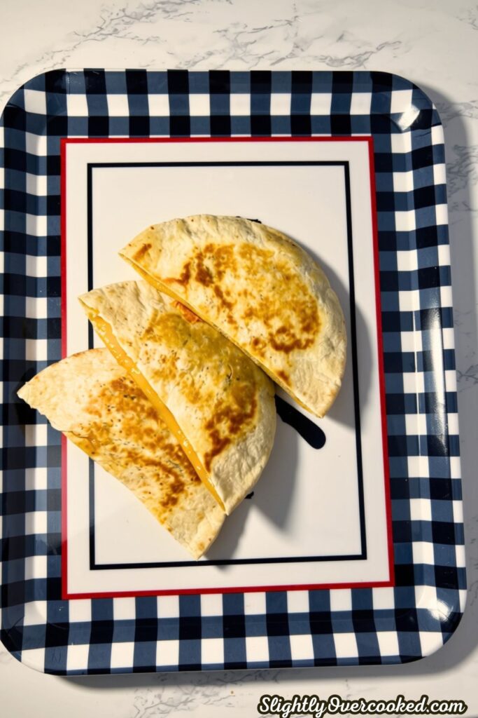 three quesadilla on a tray ready to eat