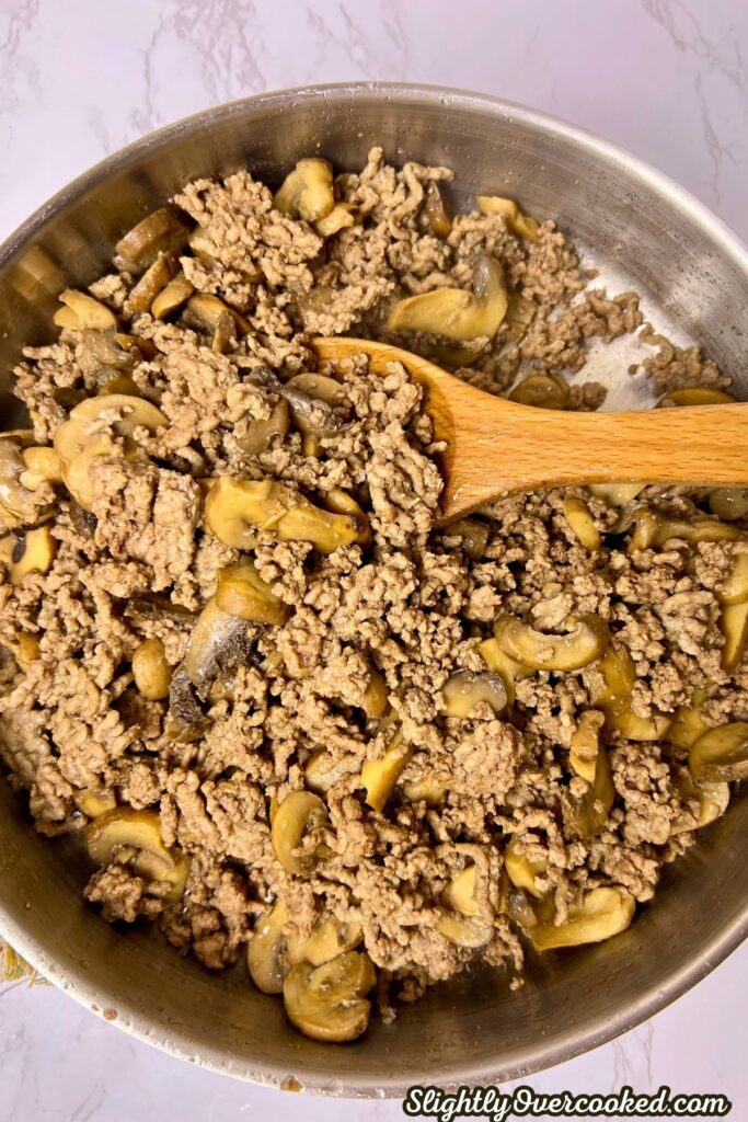 cooked ground beef in a skillet